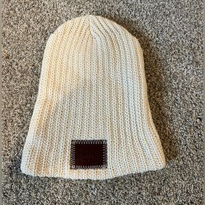 Love Your Melon beanie in cream.
